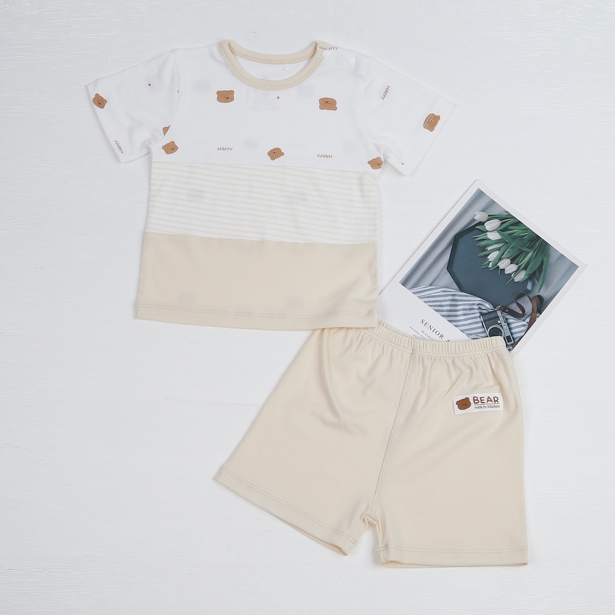 Bộ quần áo cộc tay cài vai KidsPlaza Otis ND23H (Trắng be)