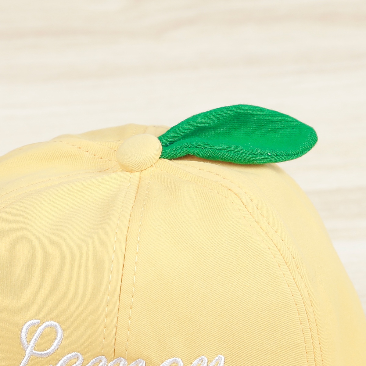 Mũ thời trang Kids Plaza 22K Lemon vàng (2-4Y) - mặt sau