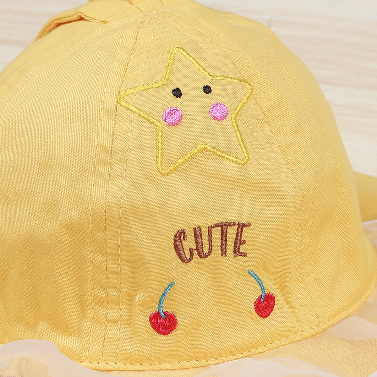 Mũ vành tròn bé gái KidsPlaza phủ voan hoạ tiết cute DN22H (Vàng)  - mặt trái