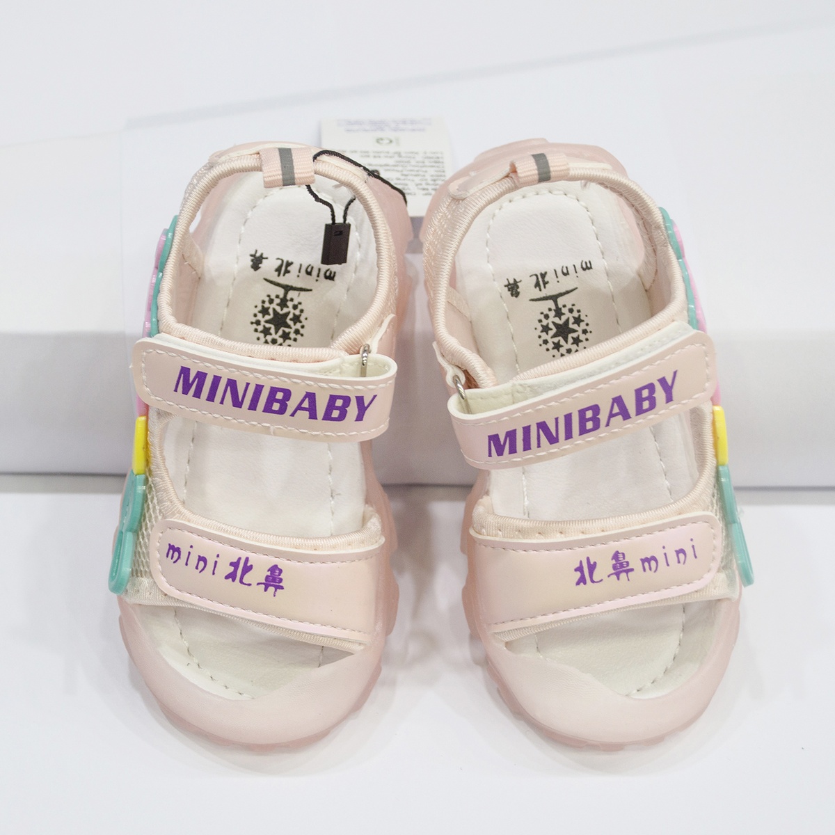 Sandal đính mặt gấu quai hồng AC - mặt phải