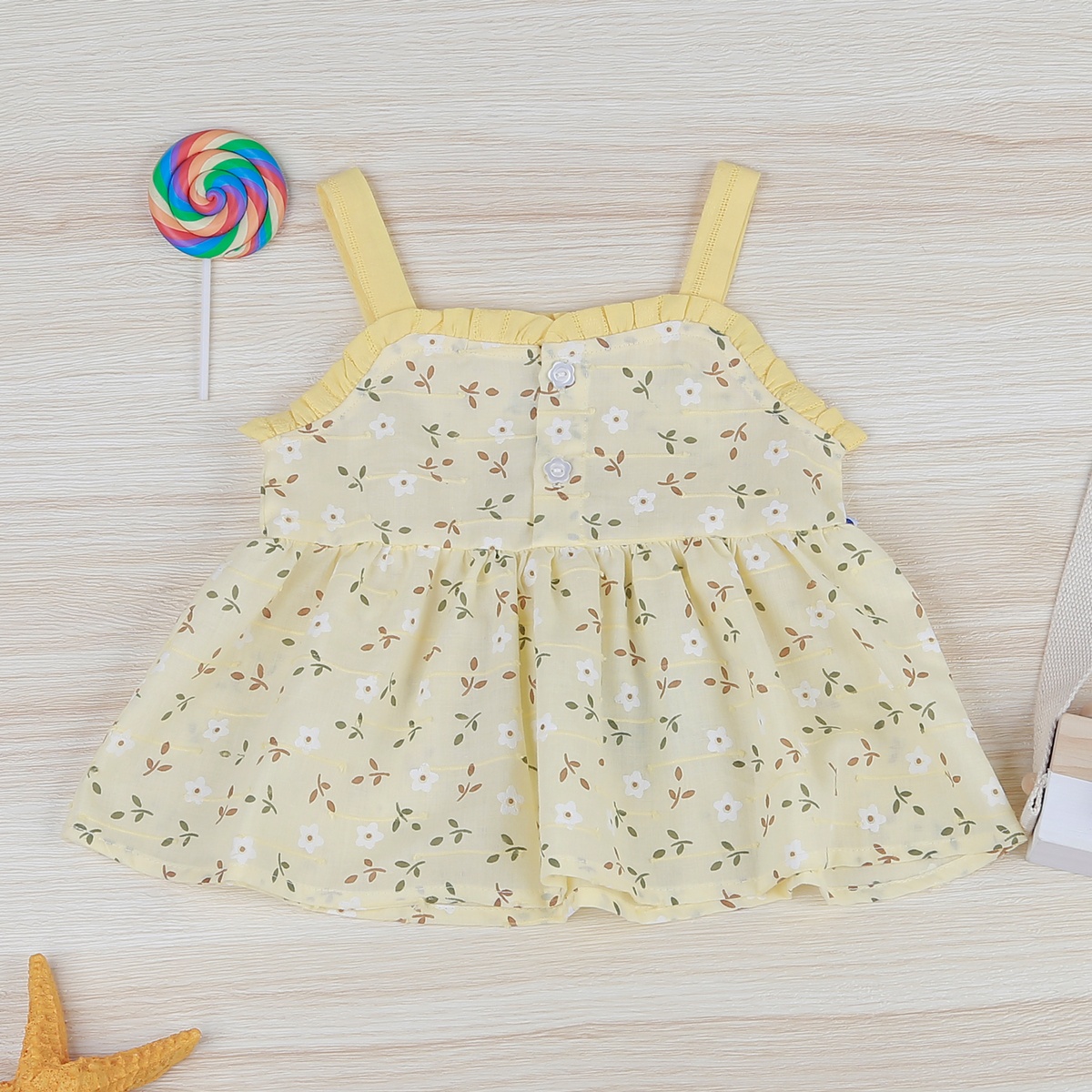 Set váy 2 dây hoa băng đô KidsPlaza HN22H vàng - mặt trái