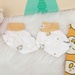 Set bao tay, bao chân KidsPlaza Otis ND24H (Trắng vàng) - mặt sau