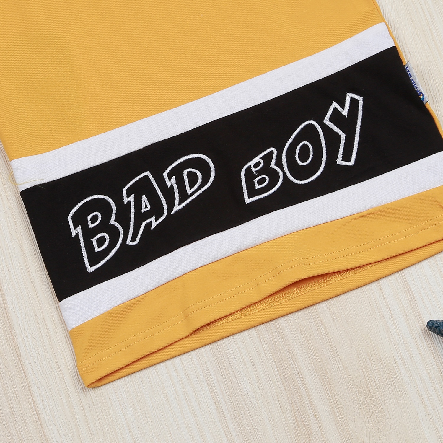 Bộ bé trai cộc tay Kids Plaza in Bad Boy VY22H (Vàng)  hình 5